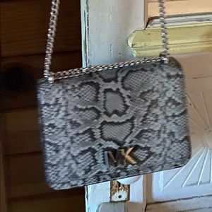 Approximately 9 X 6.5 X 2.5. Chain strap 46”.